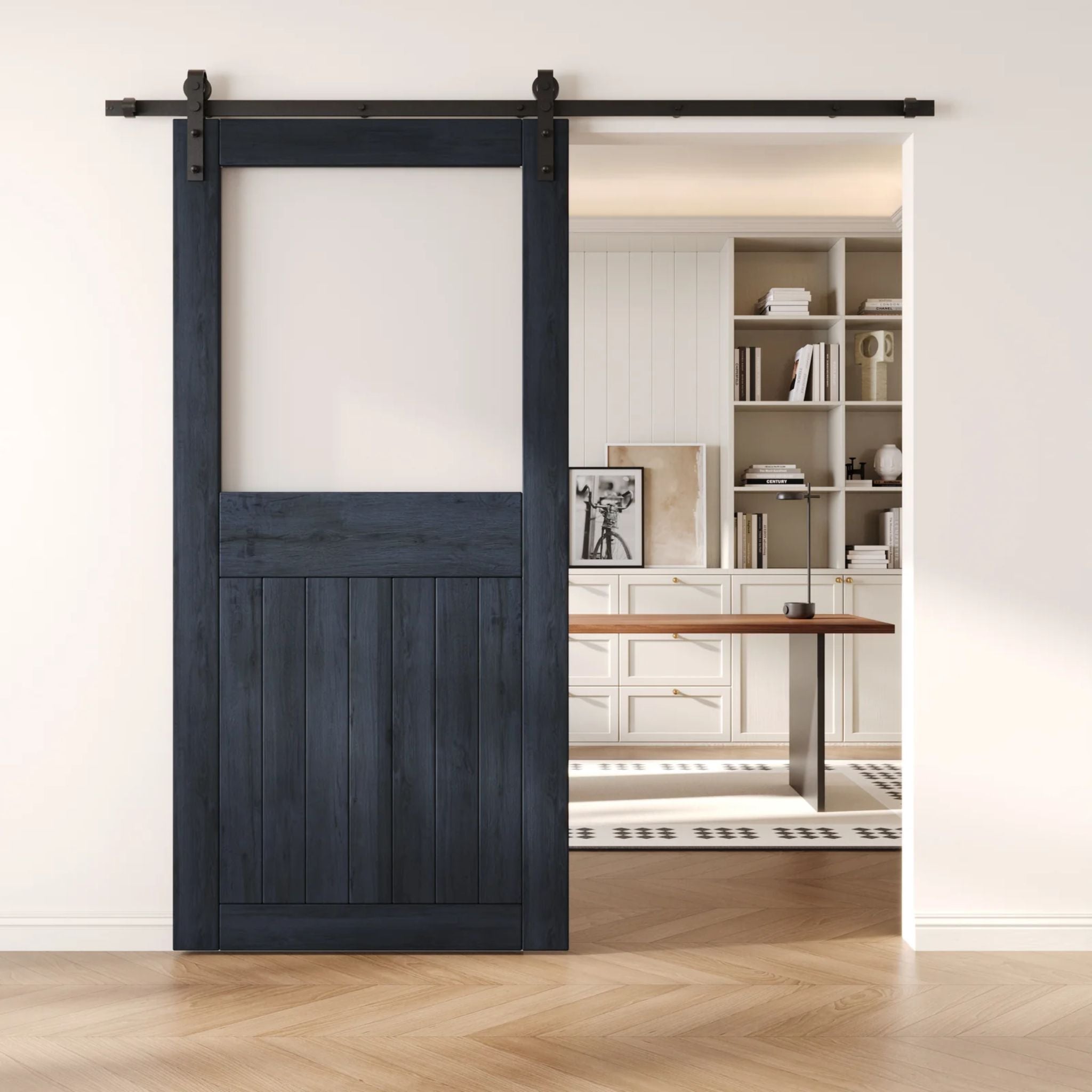 Navy sliding half-lite frosted glass barn door in a modern interior setting with a desk and shelves.