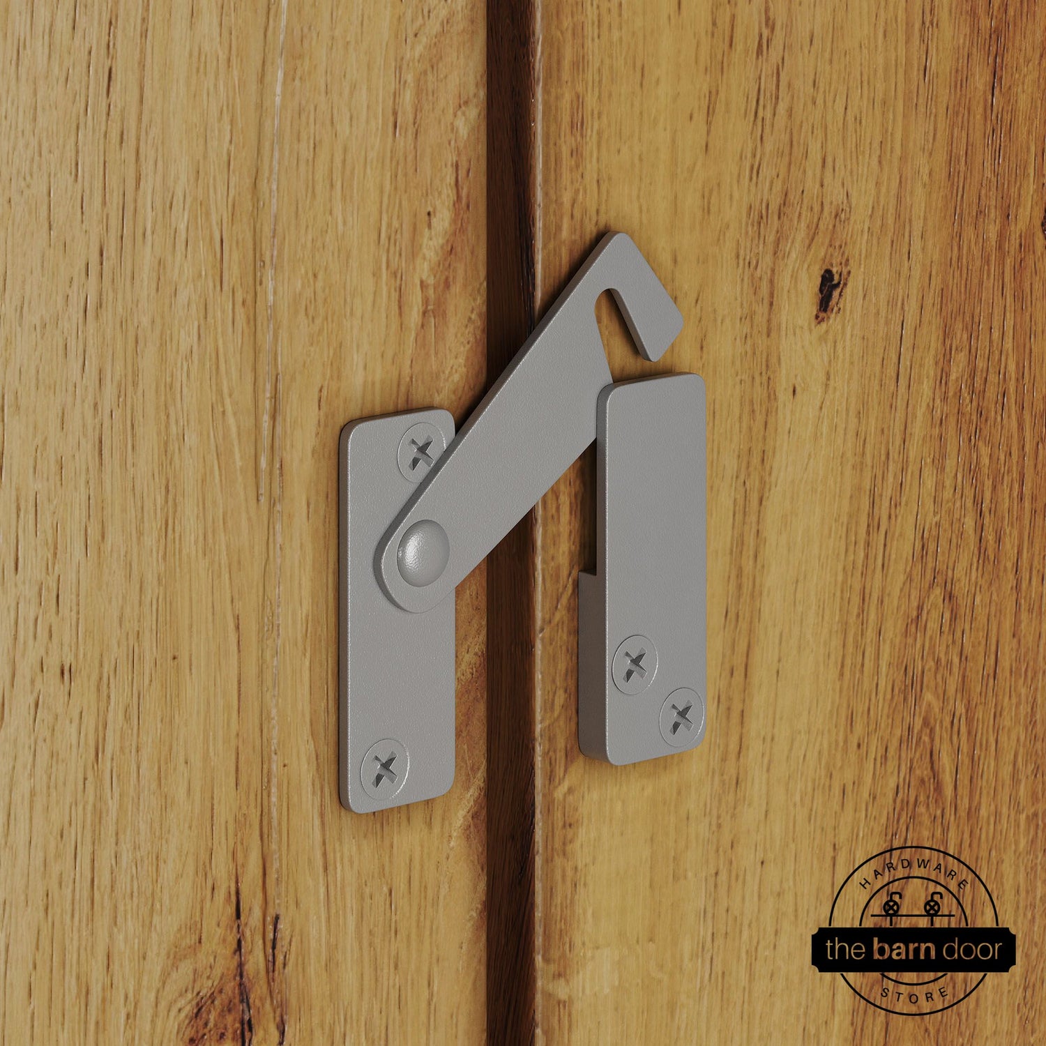 PC Chrome privacy latch for biparting barn doors, shown latched across two wood door panels