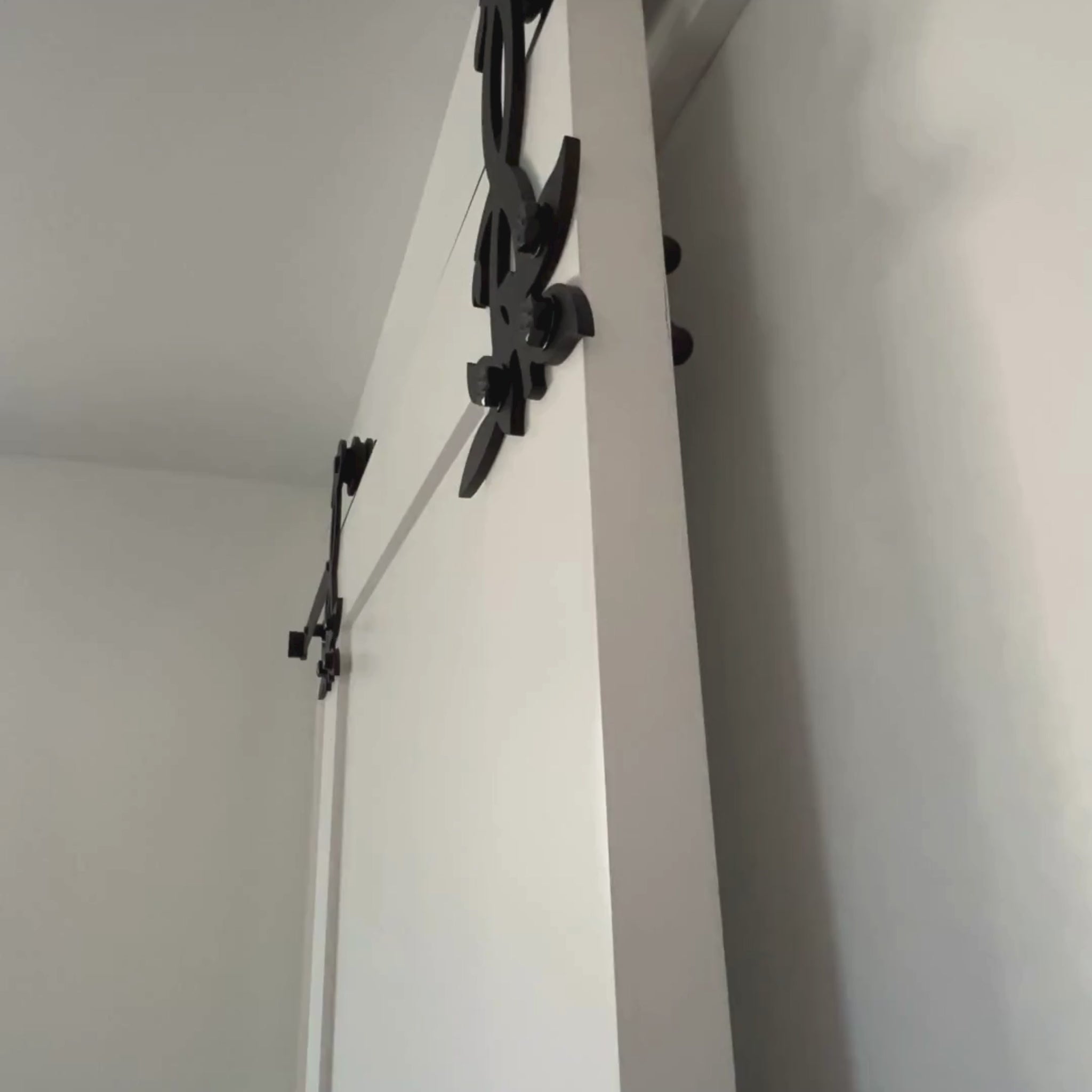 Sliding flower barn door hardware installed for a customer's bathroom