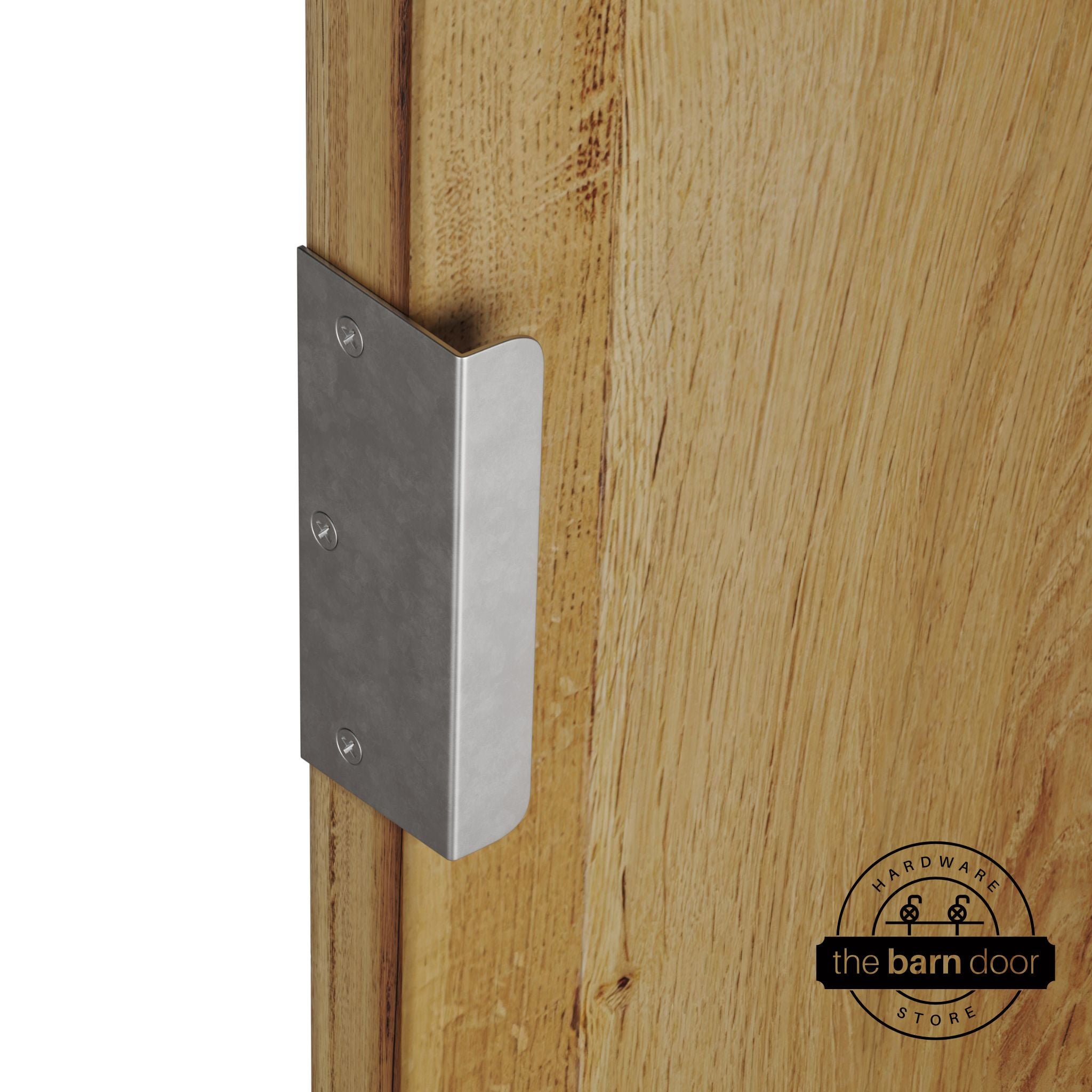 Raw steel sliding barn door edge pull handle on natural wood door edge