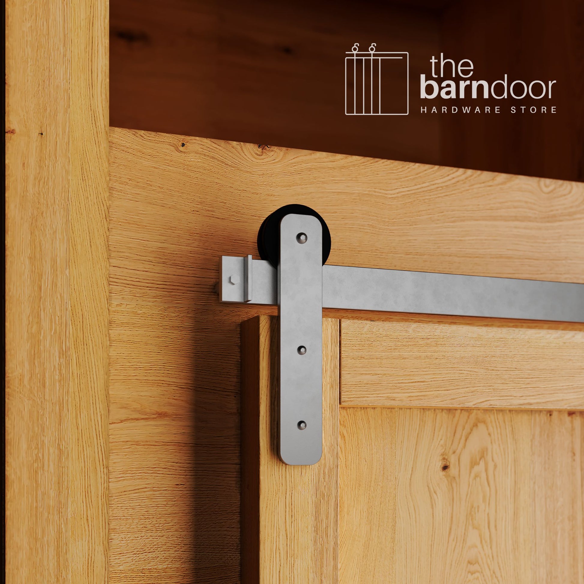 A close-up photograph of a natural oak cabinet with a sliding mini barn door, featuring a raw steel straight-strap hanger and a raw steel track system.