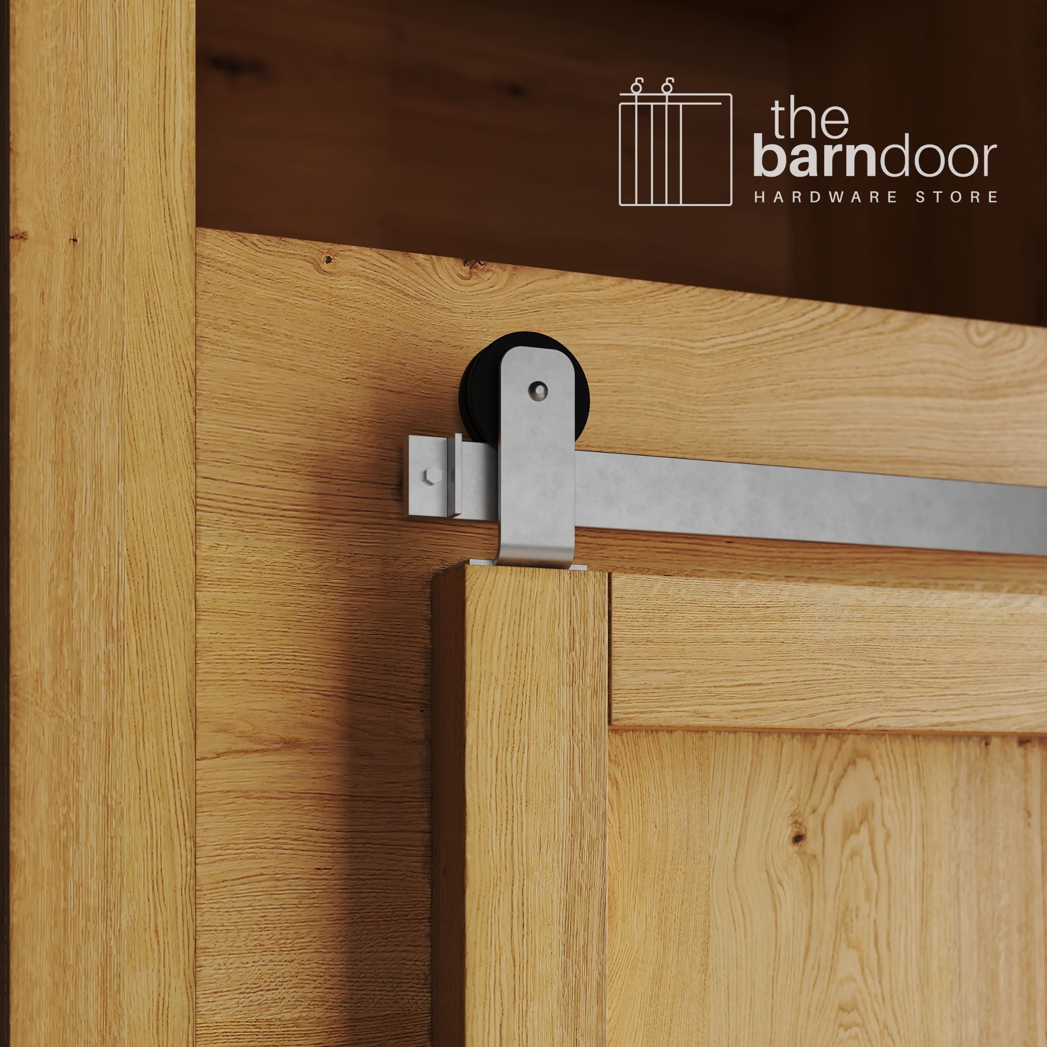 A close-up photograph of a sliding mini barn door on a natural oak cabinet, featuring raw steel top-mount straight hardware.