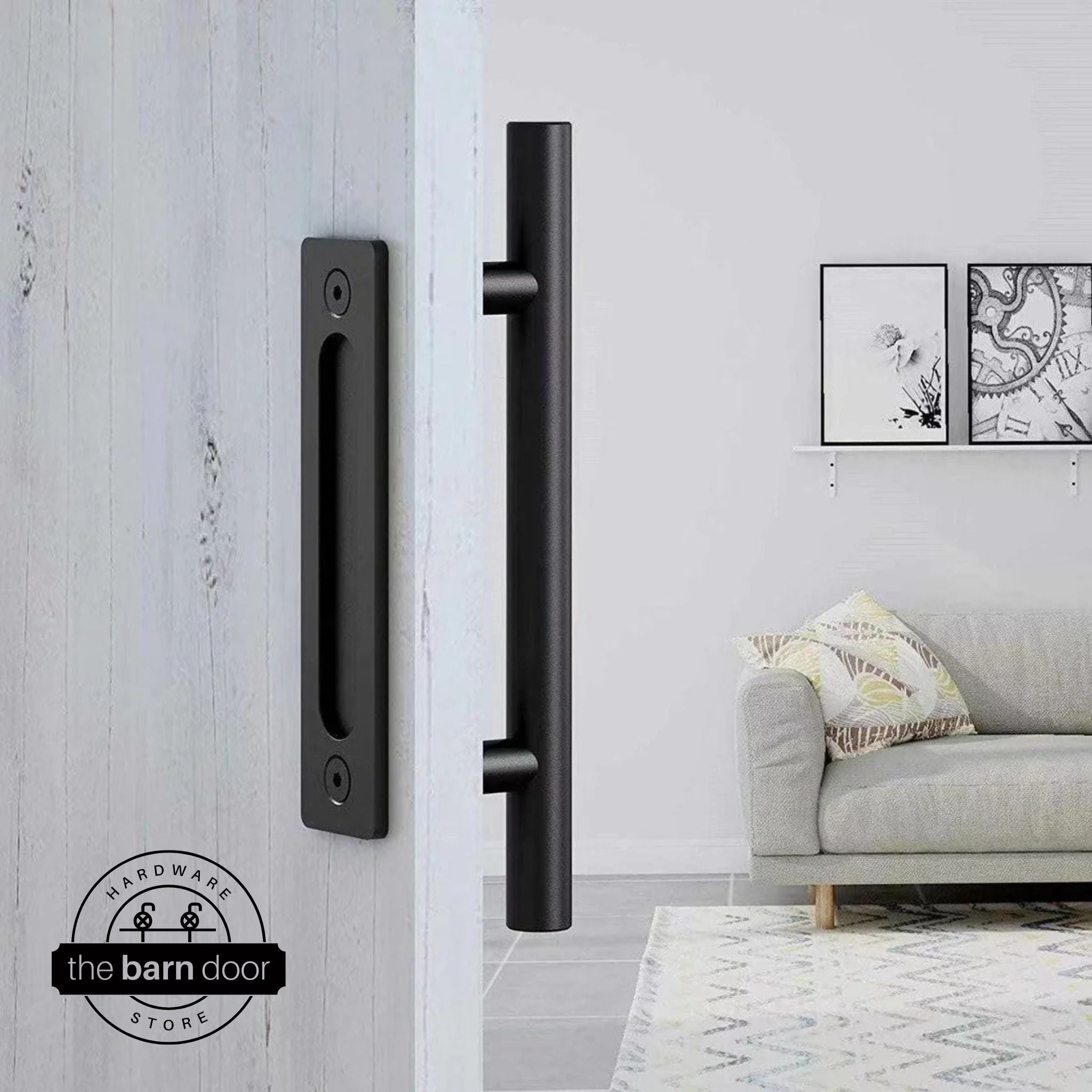 Matte black round pull and flush handle set installed on a white wood sliding barn door