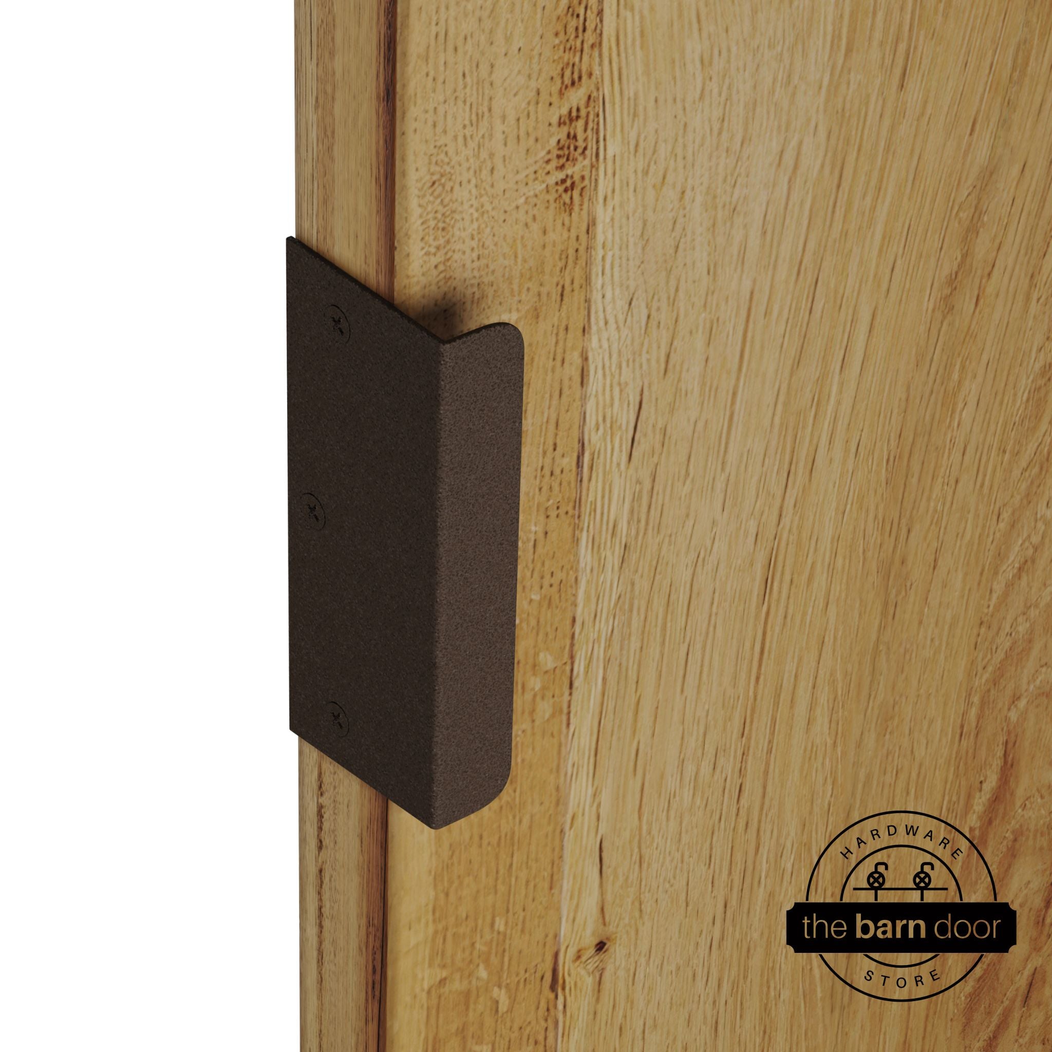 Rustic brown sliding barn door edge pull handle on natural wood door edge