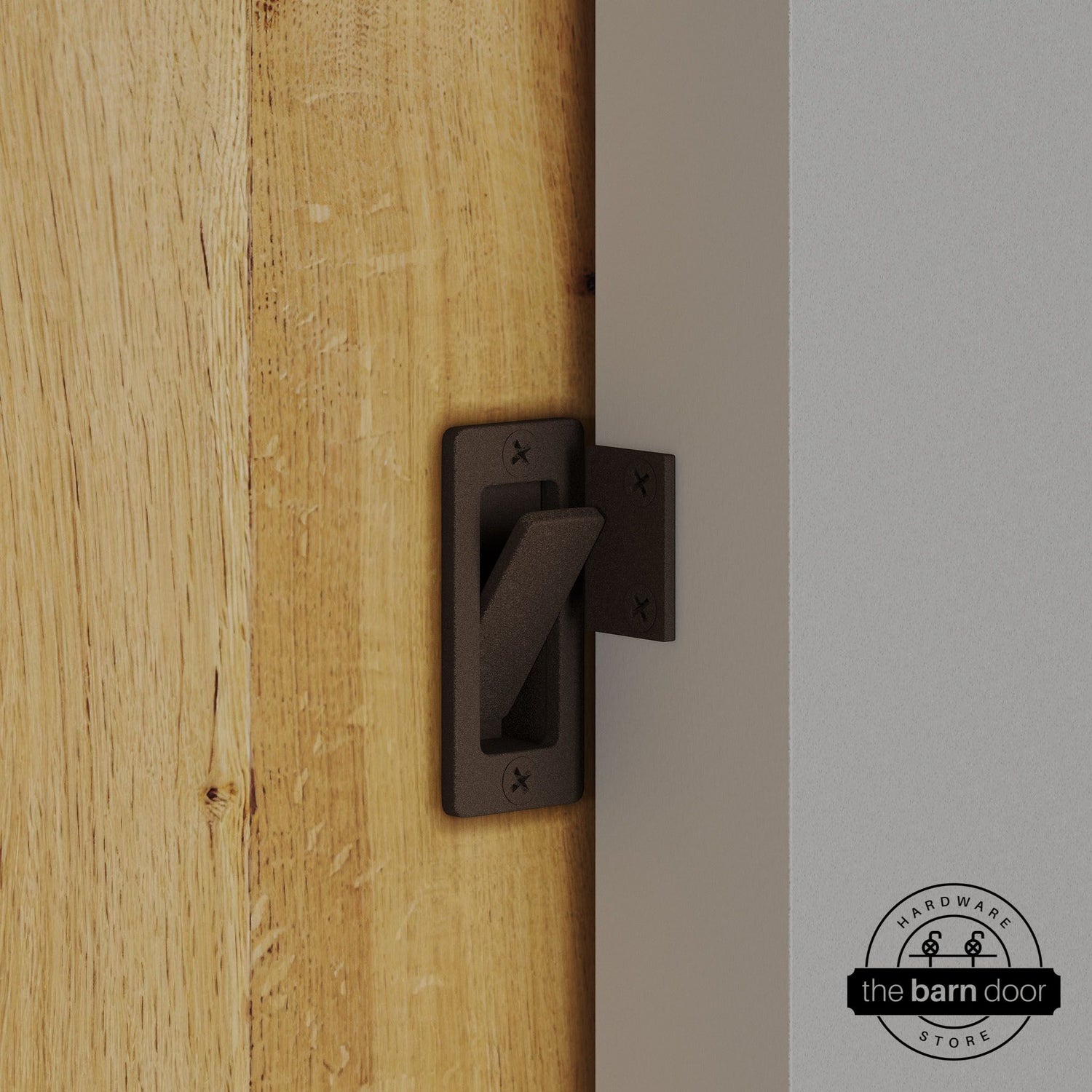 Rustic brown privacy latch installed on a sliding barn door, shown in the locked position against door frame