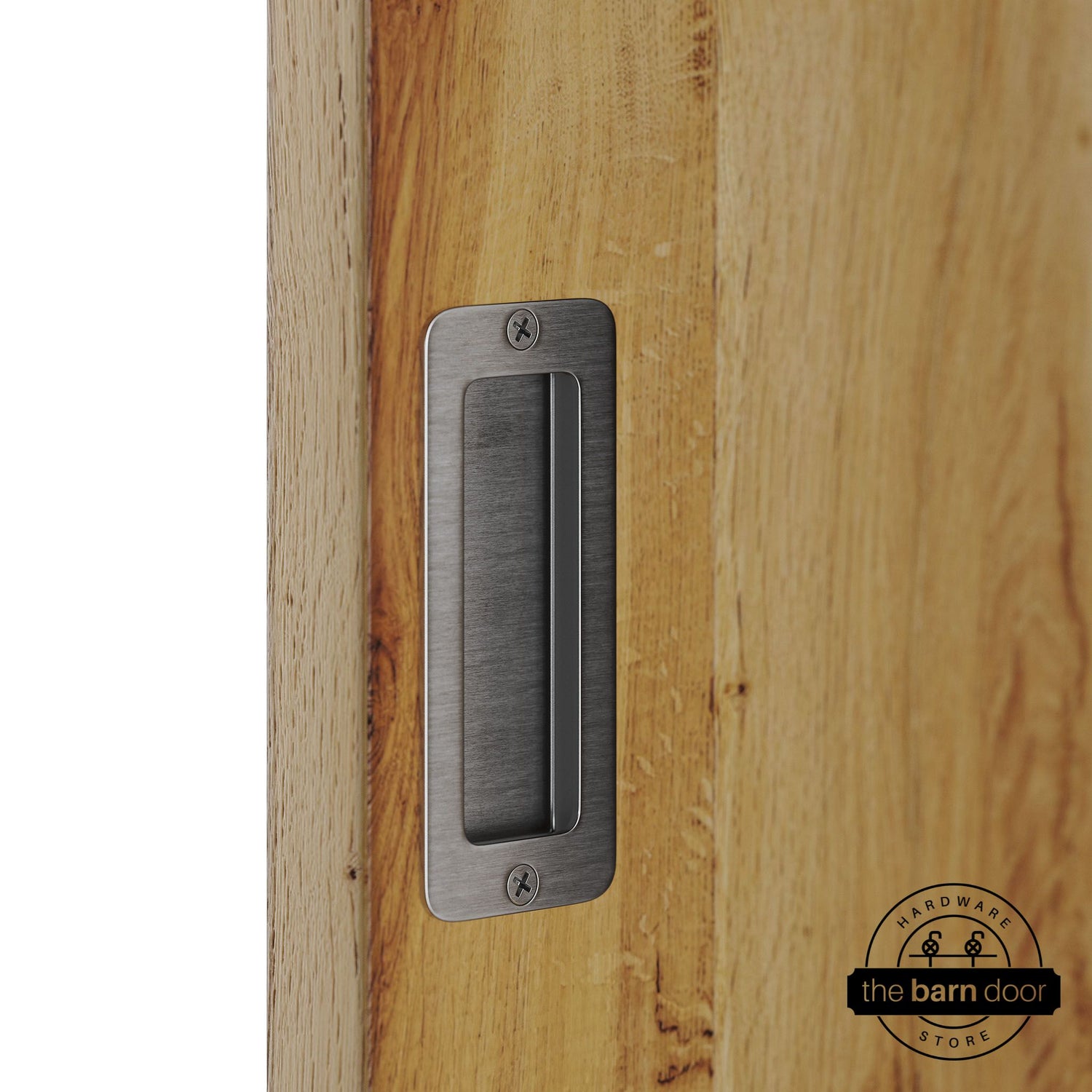 Stainless steel partial radius flush pull handle for sliding barn doors, installed on natural wood door panel