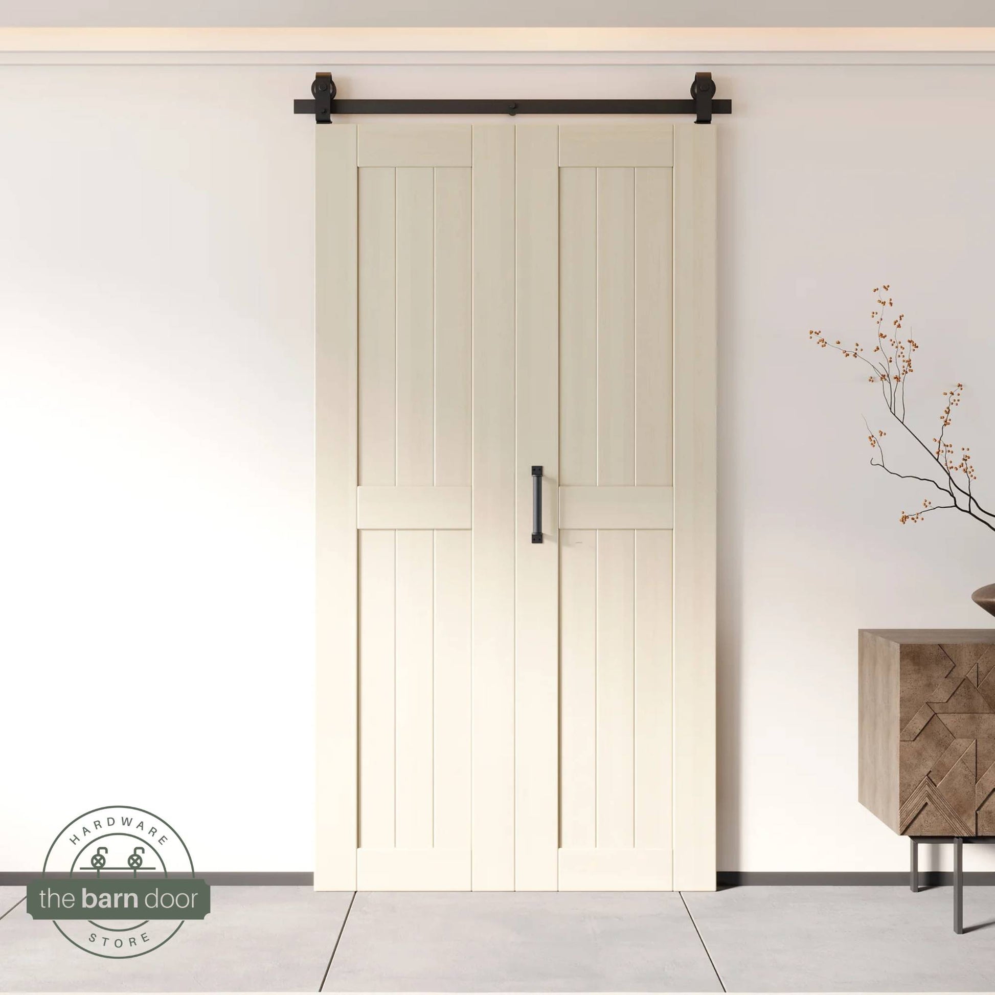 Two-panel bifold barn door in Tinsmith Gray finish, installed and fully closed in a modern interior, showing the top-mount Matte Black track.