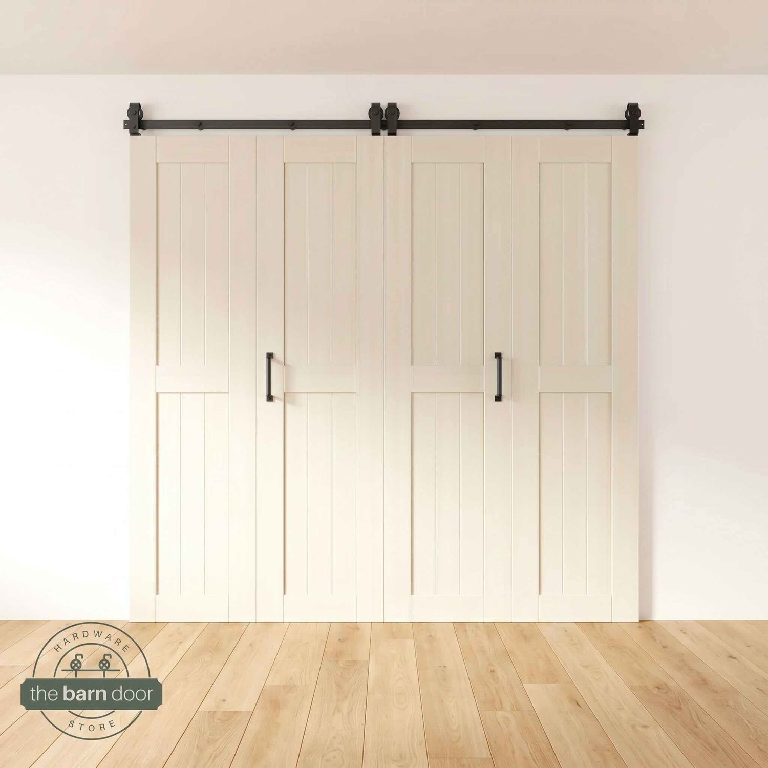Four-panel bi-parting bifold barn door in a tinsmith gray finish, fully closed in a modern entryway, showing the top-mount Matte Black track.