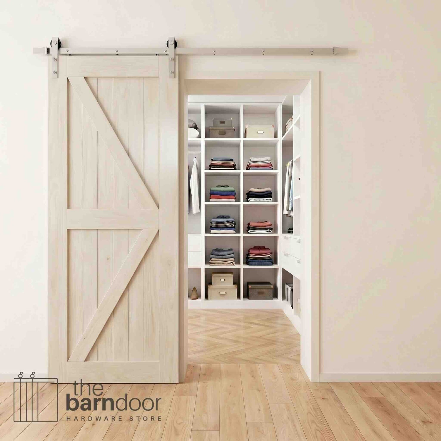 Brushed nickel barn door hardware kit on a tinsmith gray K-brace barn door, modern farmhouse style.
