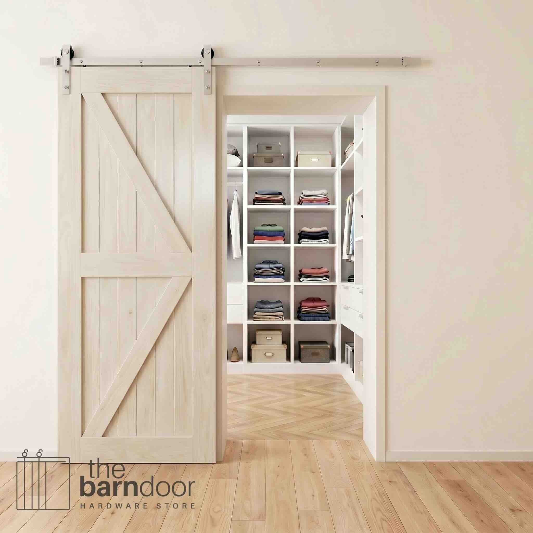 Brushed nickel barn door hardware kit on a tinsmith gray K-brace barn door, modern farmhouse style.