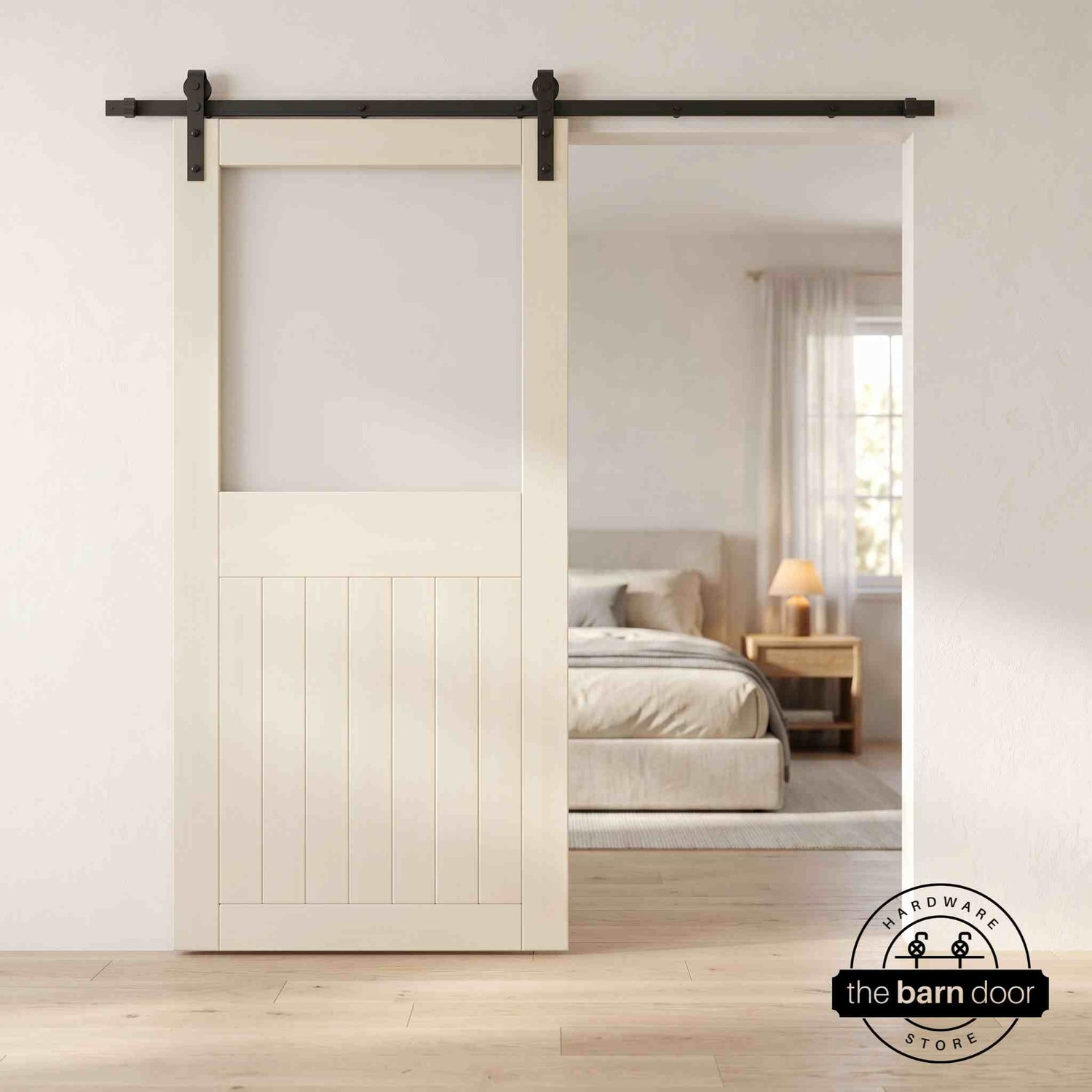 Tinsmith gray sliding half-lite frosted glass barn door in a modern interior setting with a desk and shelves.