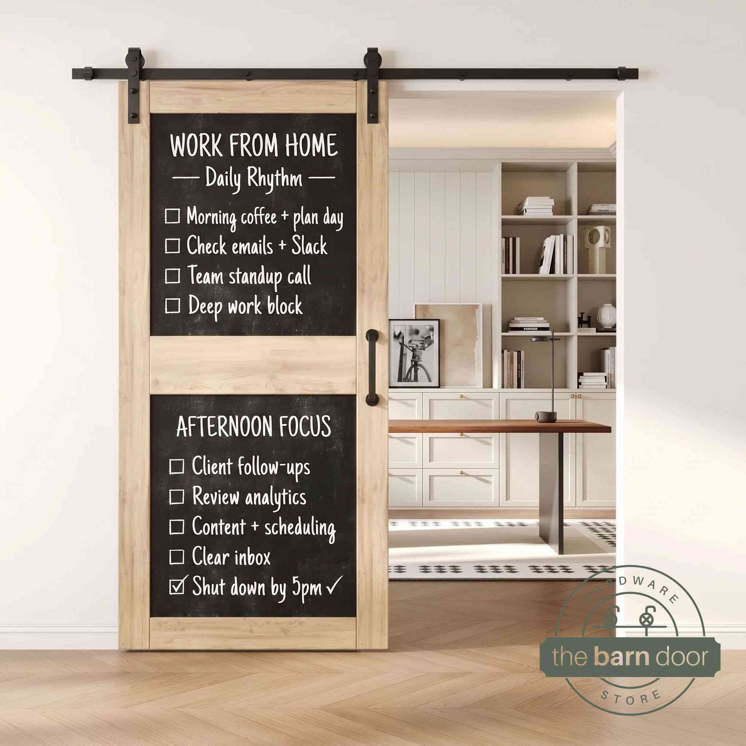 An unfinished two-panel chalkboard barn door mounted on a sleek black sliding track, shown partially open to reveal a modern home office with built-in white shelving.