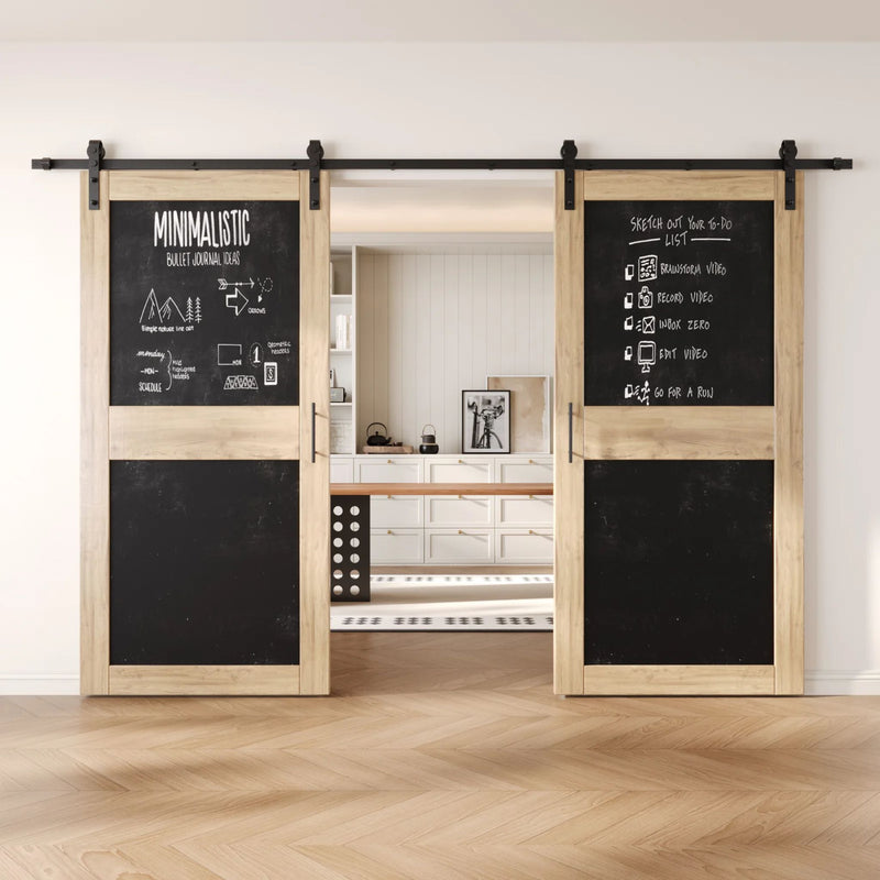Unfinished barn doors with black chalkboard surfaces in a modern interior setting