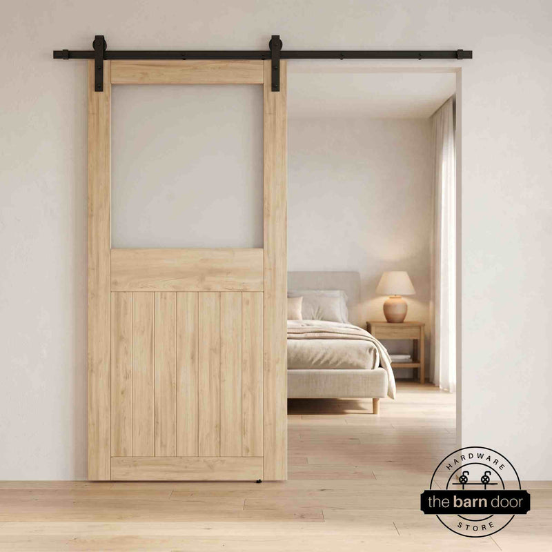 Unfinished sliding half-lite frosted glass barn door in a modern interior setting with a desk and shelves.
