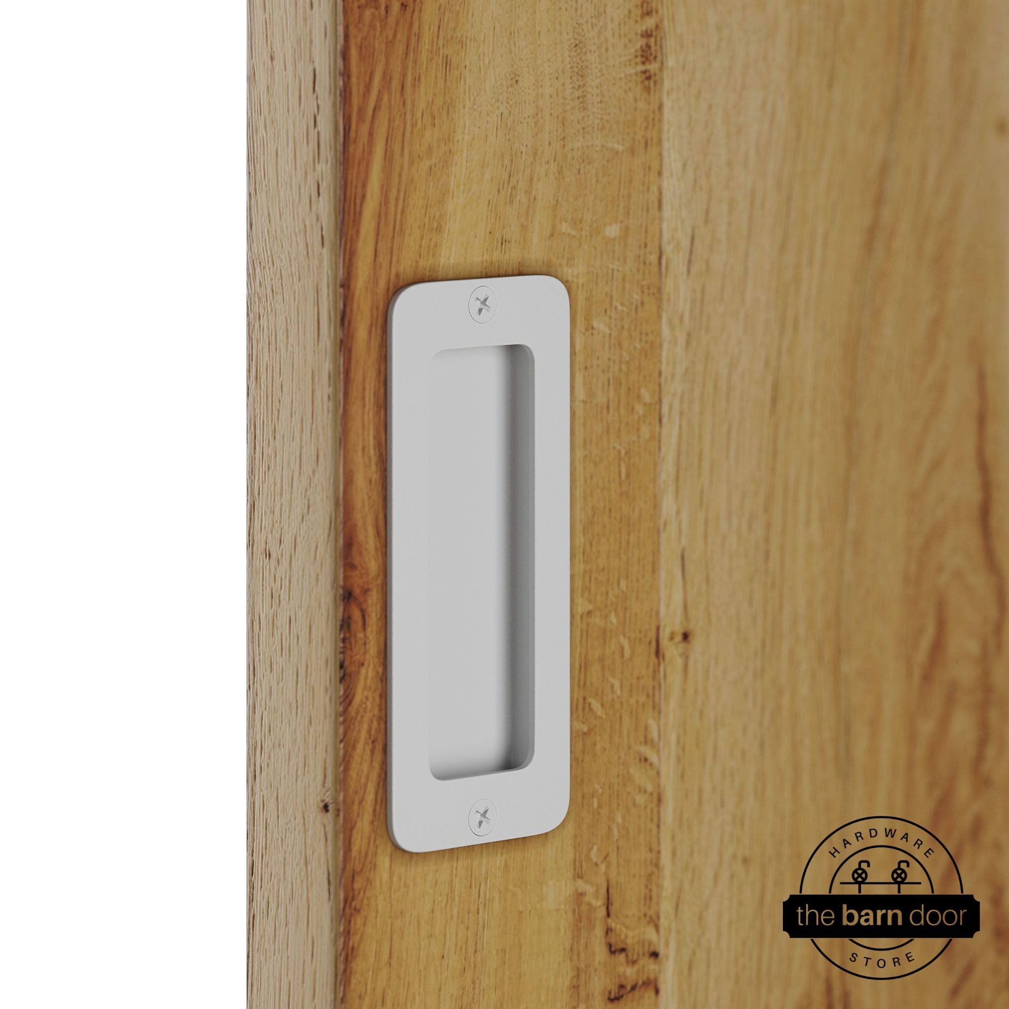 White partial radius flush pull handle for sliding barn doors, installed on natural wood door panel