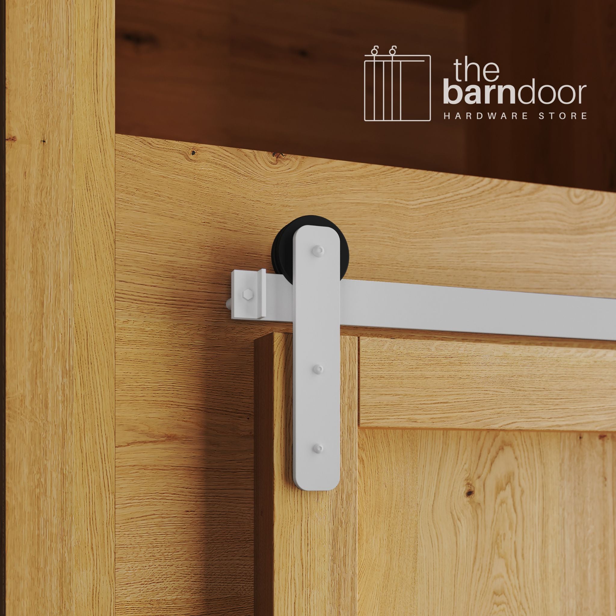 A close-up photograph of a natural oak cabinet with a sliding mini barn door, featuring a crisp white straight-strap hanger and a white track system.